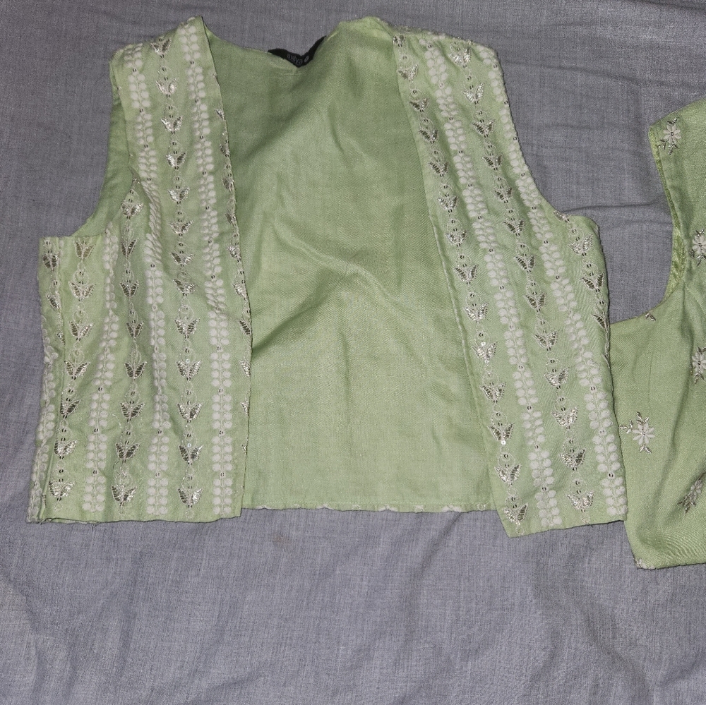 3 piece crop top, pants, vest.